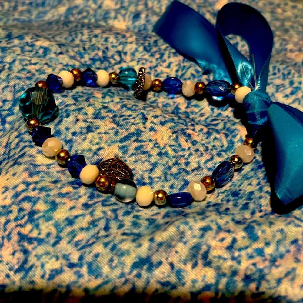 Handmade luxury beaded bracelet w Sterling Silver charms.